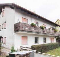 Attraktives Mehrfamilienhaus mit Garten, Balkonen und Doppelgarage in Burgpreppach