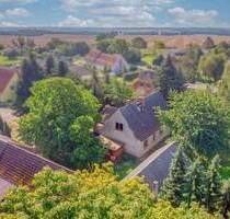 Renovierungsbedürftiges Einfamilienhaus samt Garten, 2 Garagen und 3 Freistellplätzen - Neuenkirchen
