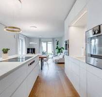 AIGNER - Exklusiv ausgestattete Erdgeschosswohnung mit 4 Zimmern und über 220 m² Garten - München