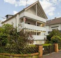 Teilvermietetes Mehrfamilienhaus in Liederbach am Taunus: Stilvolles Wohnen in attraktiver Lage