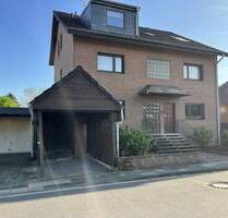 3-Zimmer Dachgeschosswohnung mit Balkon, Garage und eigenem Garten in Moers-Vennikel