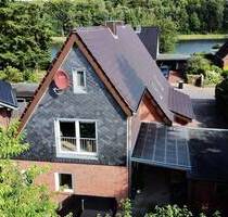 Zweifamilienhaus am Kanal - 379.000,00 EUR Kaufpreis, ca.  174,00 m² Wohnfläche in Westerrönfeld (PLZ: 24784)