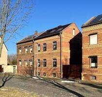 Ideal für Familien: gemütliche Doppelhaushälfte in Raguhn mit großem Garten und idyllischem Teich - Jeßnitz-Raguhn/ Raguhn