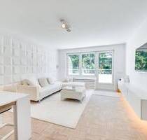 AIGNER - Lichtdurchflutete Penthousewohnung mit umlaufenden Balkon und Nähe zum Perlacher Forst - Unterhaching