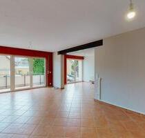 Charmante 3-Zimmer-Hochparterrewohnung mit Balkon, Garage und Gartennutzung in Au am Rhein