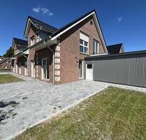 Vermietung: Erstbezug, moderne Erdgeschosswohnung mit Terrasse und Carport in Westoverledingen