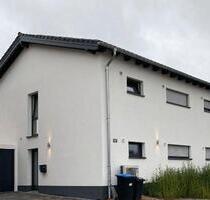 **Neubau EG-Wohnung mit hochwertiger EBK und Garten** - Hamminkeln