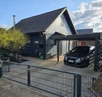 Holzhaus in Sassenburg mit großem Grundstück & Badesee