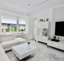 Top-modernisierte 3-Zimmerwohnung mit Gartenanteil und Garage - Melsdorf