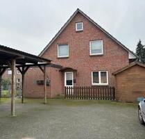 Moderne 2-Zimmer-Terrassenwohnung mit Carport und Gartenhaus in zentraler Lage Barendorf