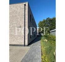 POPPE | Neubau: Stilvolle 3-Zimmer-Wohnung mit eigenem Garten - Wildeshausen