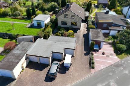 Großes Einfamilienhaus mit 5 Garagen und idyllischem Garten auf 1945 m² Grundstück im schönen Langen - Geestland