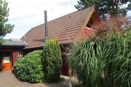 Exklusives Ferienhaus in Holzbohlenbauweise ( 4fach - Verzahnung) mit Sauna und Terrasse sowie Südbalkon. - Otterndorf