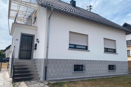 Grundstück mit Zweifamilienhaus - Weiskirchen