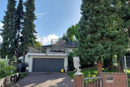 FREISEN! Freistehender, großzügiger Bungalow mit Einliegerwohnung, Wintergarten, Terrasse, Garten und Doppelgarage (+Zufahrt Rückseite) in Freisen OT