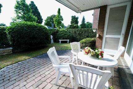 Traumhafte 122 m² Erdgeschosswohnung mit großzügigem Garten, Terrasse und TG Platz in Büderich - Meerbusch