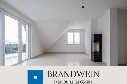 Modernes Wohnen im Dachgeschoss – Neubau mit Kamin und großem Balkon - Hiddenhausen