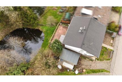 Einfamilienhaus in Much mit 1.670 m² Grundstück, Naturteich, Bach