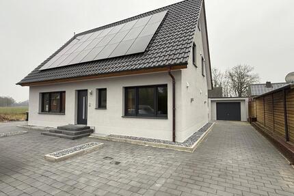 Erstbezug Erdgeschosswohnung Spelle mit Garage und großen Garten