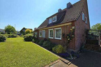 Gepflegtes Einfamilienhaus im Zentrum von Vögelsen mit Garage, Carport und schönem Garten
