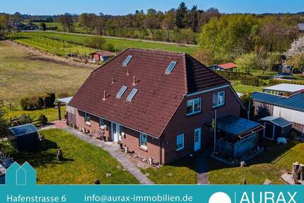 Solides Zweifamilienhaus mit Klinker und Krüppelwalmdach in ruhiger Lage von Großheide - 175 m² Wohnfläche, zwei Einheiten, großes Grundstück