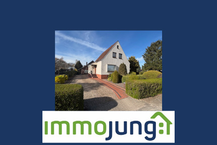 Einfamilienhaus mit zusätzlichem Nebengebäude und großzügigem Garten in zentraler Lage von Grasberg