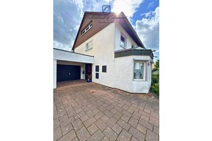 Einfamilienhaus mit Wintergarten, Garage + parkähnlichem Garten - Saarbrücken / Klarenthal