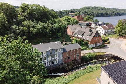 Kernsanierte Obergeschosswohnung in der historischen Gremsmühle an der Schwentine mit 2 Balkonen - Malente Bad Malente-Gremsmühlen