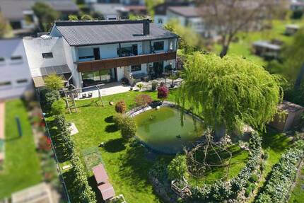 Stilvoll modernisiert & einzigartiger Garten mit Badeteich auf 1.040 m² Grundstück - Velden