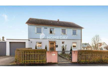 Familienfreundliches Einfamilienhaus mit 7 Zimmern und zwei Garagen in Gaibach - Volkach