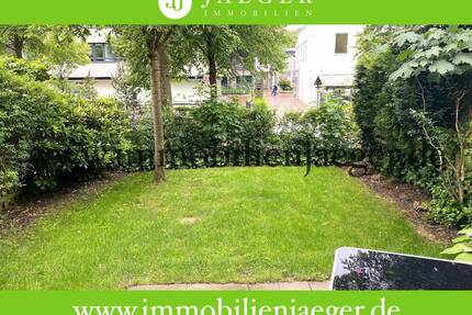 Charmante Erdgeschosswohnung mit Terrasse und Gartenanteil - Wohnbereich mit offener Einbauküche - Norderstedt Garstedt