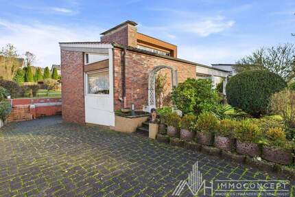 Zeitlose Architektur mit Haltung - Bungalow in Bestlage von Wittlich mit MFH-Potenzial