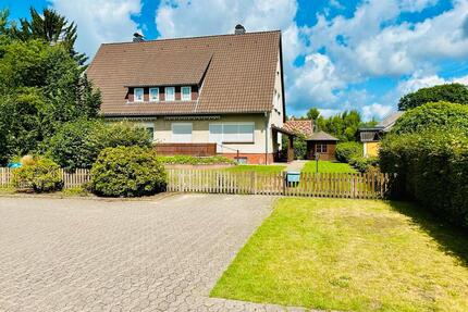 Doppelhaushälfte und separates Baugrundstück - Faßberg