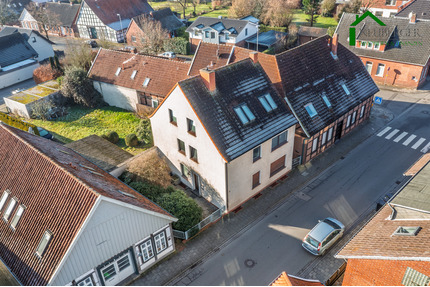 Solides Mehrfamilienhaus mit 3 Wohneinheiten, 4 Garagen und Entwicklungspotenzial - Quakenbrück Altstadt