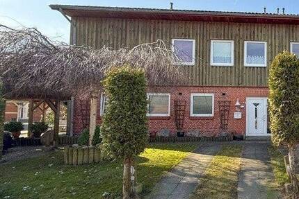 Großzügiges Wohnen mit Potenzial! Reihenendhaus mit Doppelcarport und Garage in Hüllerup - Handewitt
