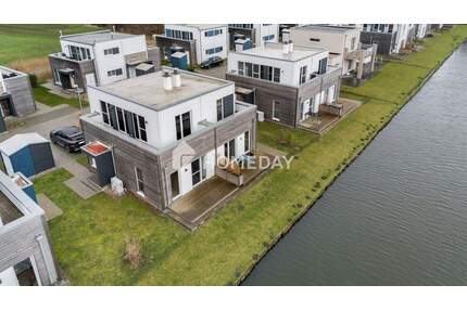 Zweitwohnsitz zum Wohlfühlen: exklusives Ferienhaus mit Terrasse, Balkon und Garten - Butjadingen Tossens