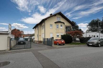 Zentral gelegenes Mehrfamilienhaus mit sonnigen Balkonen und Gewerbehalle! - Laudenbach