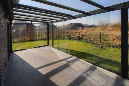 Familienoase vor Sylt: Moderne KfW-40 Doppelhaushälfte mit Wintergarten in Klanxbüll