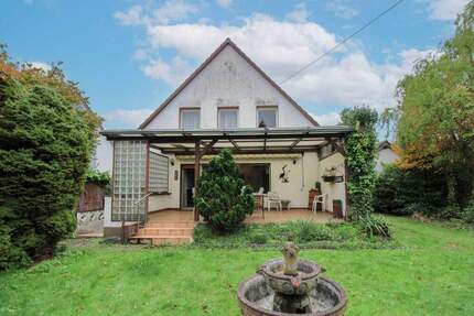 Großes, ruhig gelegenes Einfamilienhaus mit traumhaftem Garten in Köln-Auweiler