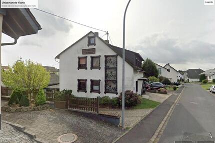 Einfamilienhaus mit WerkstattLagerhallen - Büchel