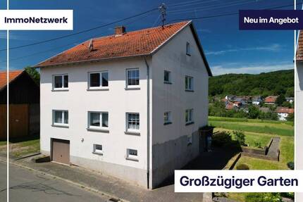 Gartenparadies mit Weitblick - großzügiges Zweifamilienhaus in Krottelbach