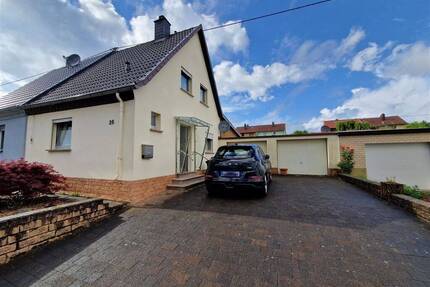 Einseitig angebautes FH mit Garten und 2 Garagen in ruhiger Lage 66539 NeunkirchenFurpach