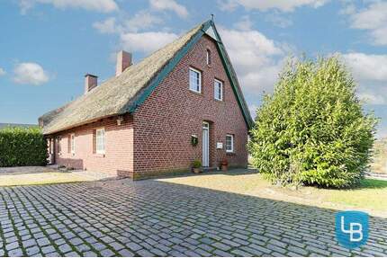 Reetdachidylle im Norden - DHH auf großem Grundstück mit Ausbaupotenzial - Helmstorf / Kühren