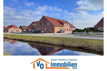 Erstbezug: Großzügige Oberwohnung mit Carport in Kanallage von Großefehn