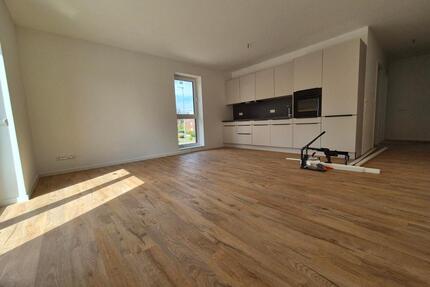 Lichtdurchflutete Neubau-OG-Wohnung mit Aufzug, TG & hochwertiger EBK - Norderstedt