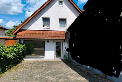 Doppelhaushälfte mit Ladengeschäft und Garten in Melle Mitte