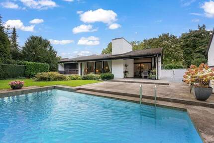 Neu-Isenburg Zeppelinheim: Freistehender Bungalow mit Pool und Einliegerwohnung