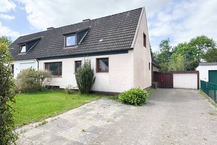 Doppelhaushälfte in ruhiger Lage von Moorrege mit flexibler Raumaufteilung und Garten