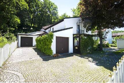 :TSC IMMOBILIEN | GAUTING | FREISTEHENDES EINFAMILIENHAUS IN BESONDERER ARCHITEKTUR