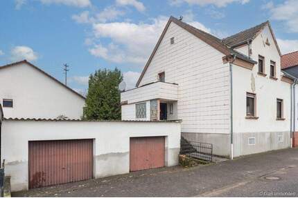 Hostenbach - Einfamilienhaus mit 2 Garagen in ruhiger Wohnlage - Wadgassen